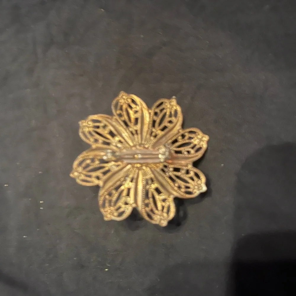 Vintage Gold Tone Filigree Brooch with pink stone center